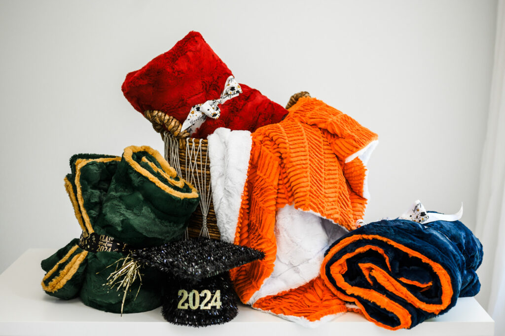 Collection of Collegiate styled blankets by Plums & Pumpkins
